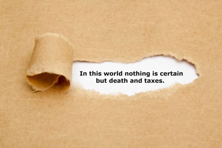 Brown paper torn open to reveal the quote 'In this world nothing is certain but death and taxes.'