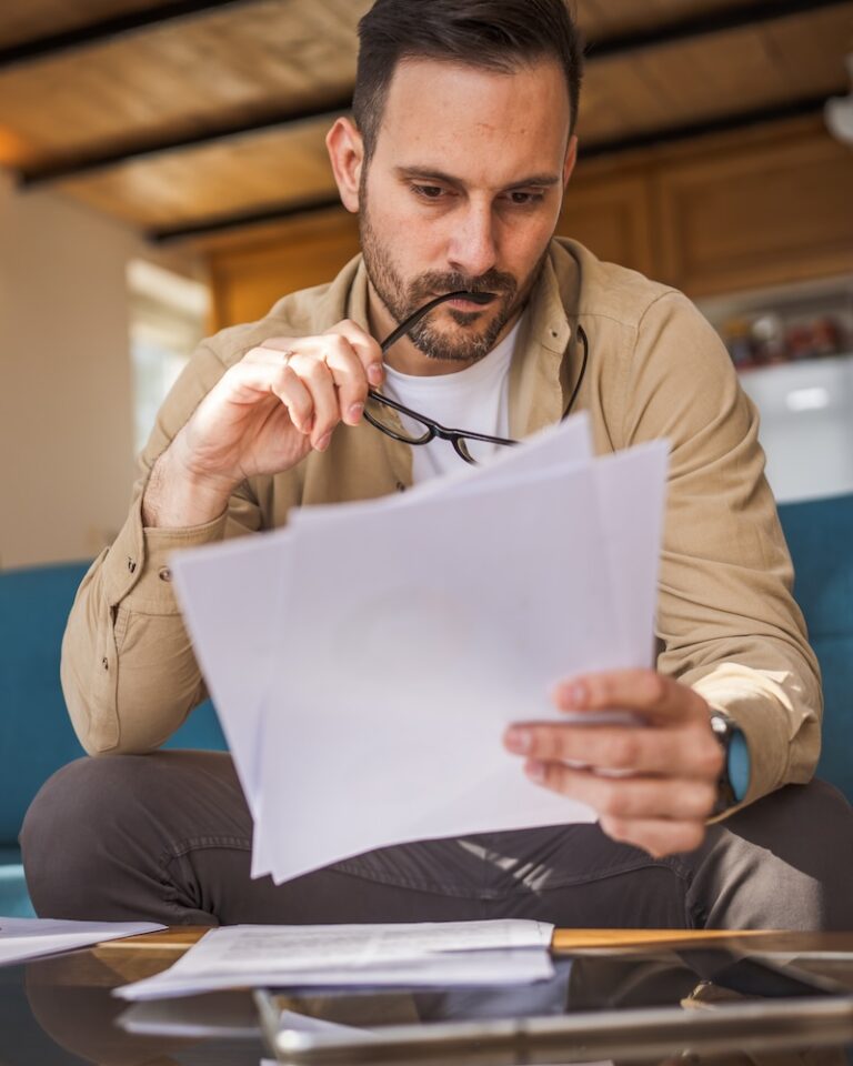 Adult man read and watch document work at home