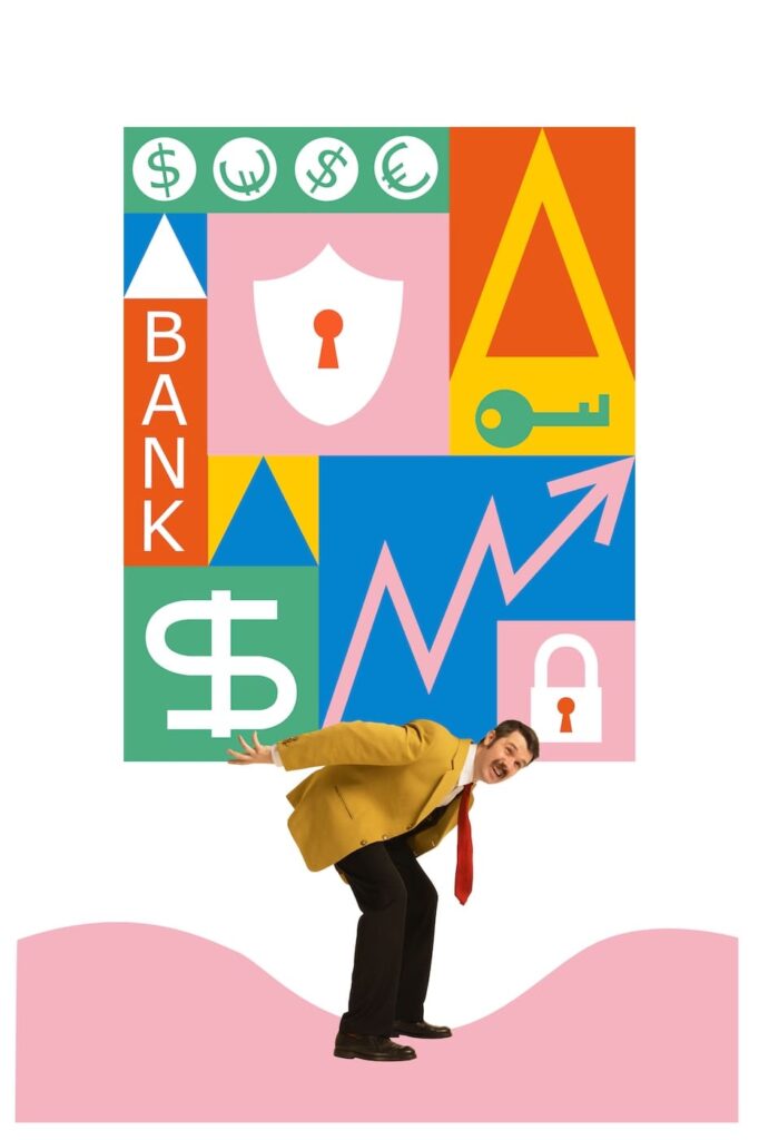 A man in a mustard-yellow jacket and red tie bends forward, appearing to struggle under the weight of a large, colorful block above him. The block contains financial symbols such as dollar signs, a bank label, a key, a lock, a shield, and an upward arrow chart, representing themes of finance, security, and economic pressure.