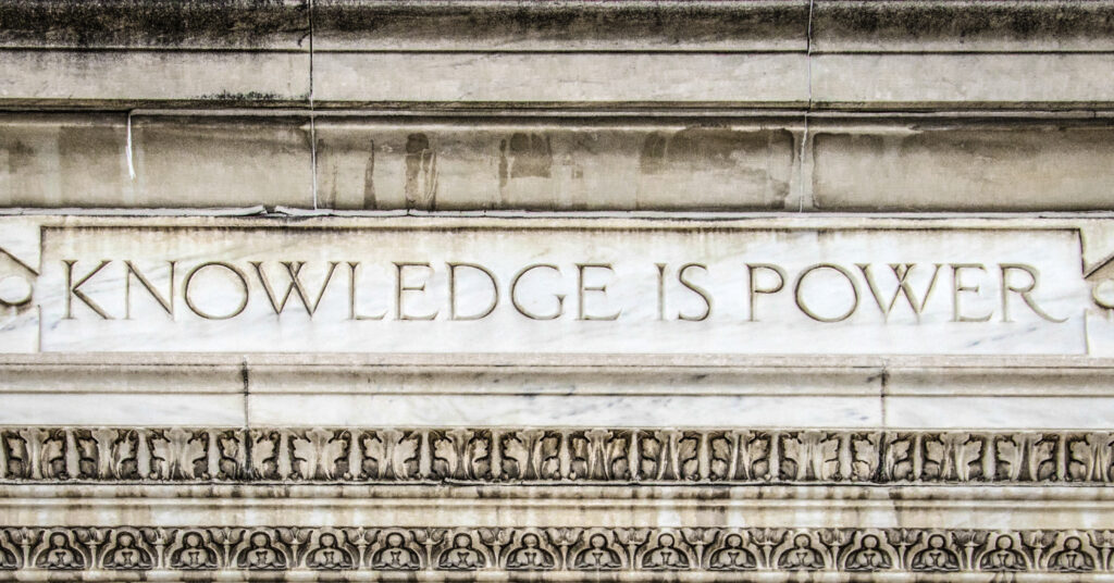 Knowledge is power carved into granite.