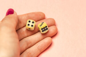 hand with a pair of dice