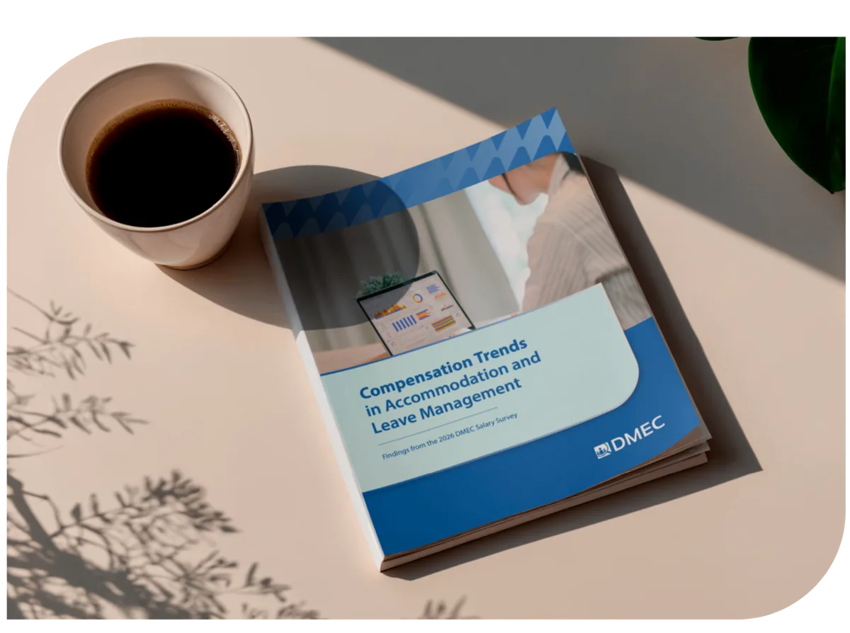 2026 DMEC Salary Survey report cover on a desk next to a cup of coffee